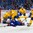 BUFFALO, NEW YORK - JANUARY 4: Sweden's Jacob Moverare #27 and Lias Andersson #24 battle for the puck against USA's Max Jones #49 during the semi-final round of the 2018 IIHF World Junior Championship. (Photo by Andrea Cardin/HHOF-IIHF Images)

